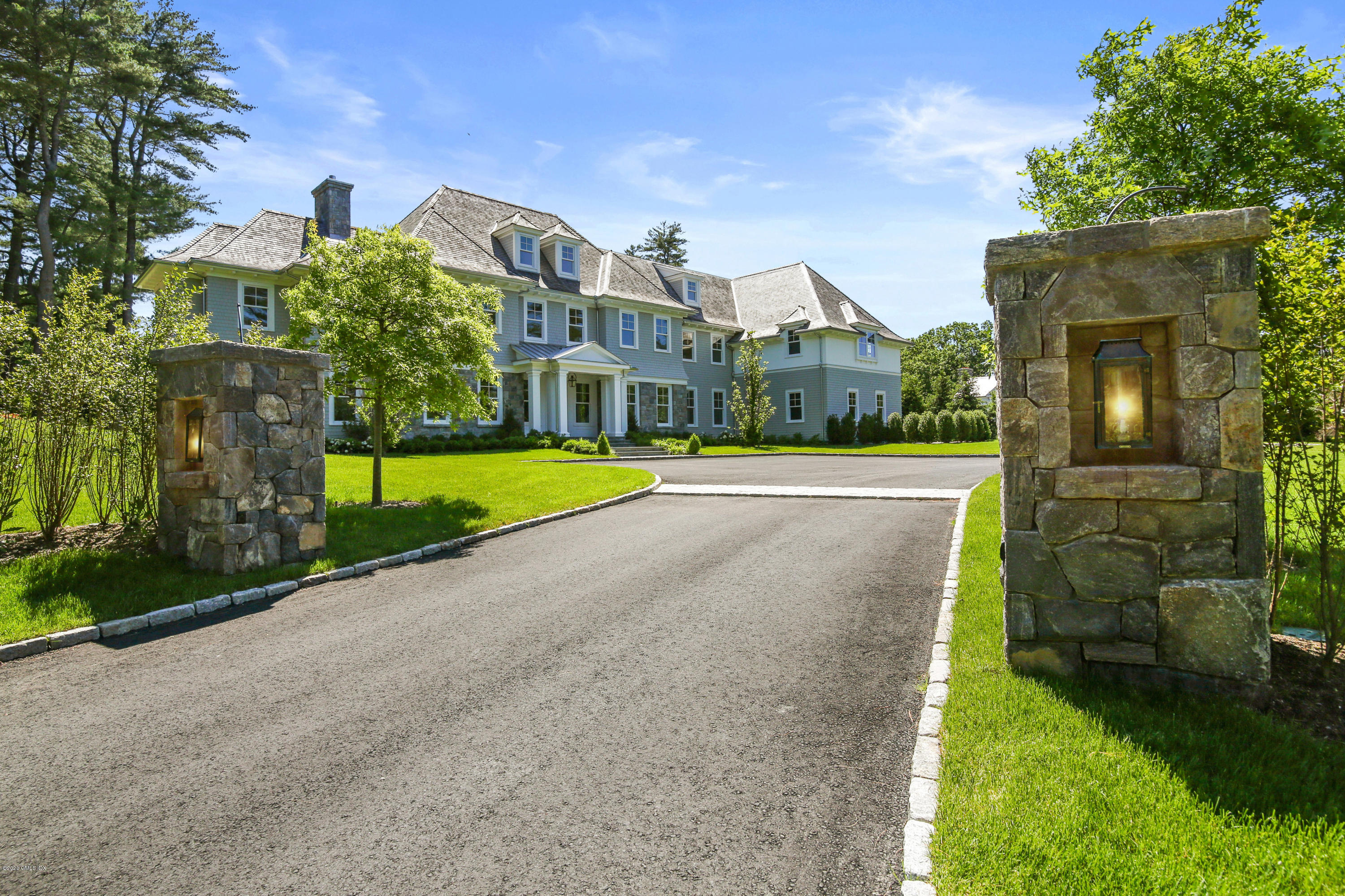 498 Lake Avenue Greenwich, CT 06830 - Photo 4 of 37 a view of a city with tall buildings and a big yard
