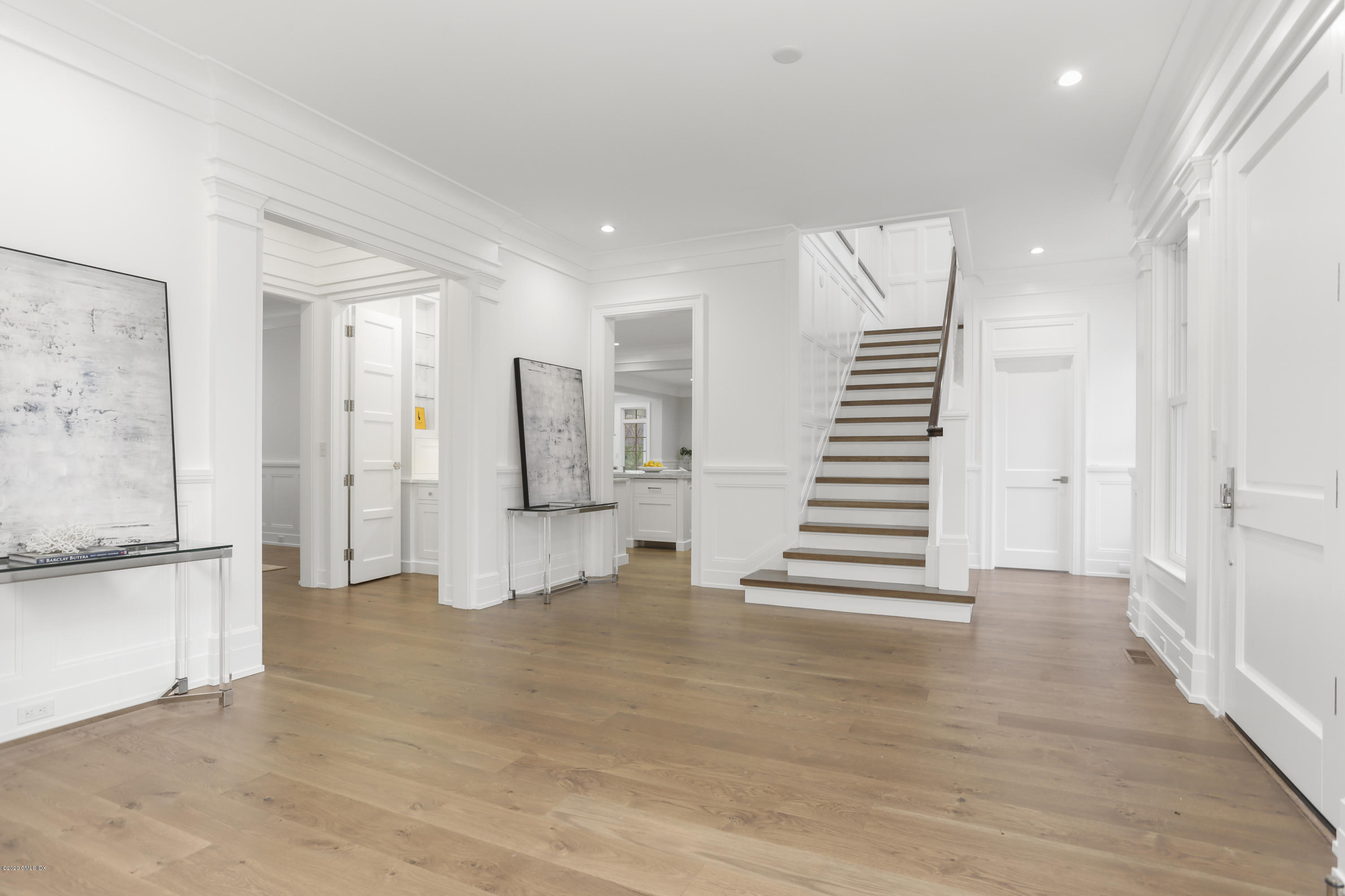 498 Lake Avenue Greenwich, CT 06830 - Photo 5 of 37 a view of a kitchen with wooden floor and stairs