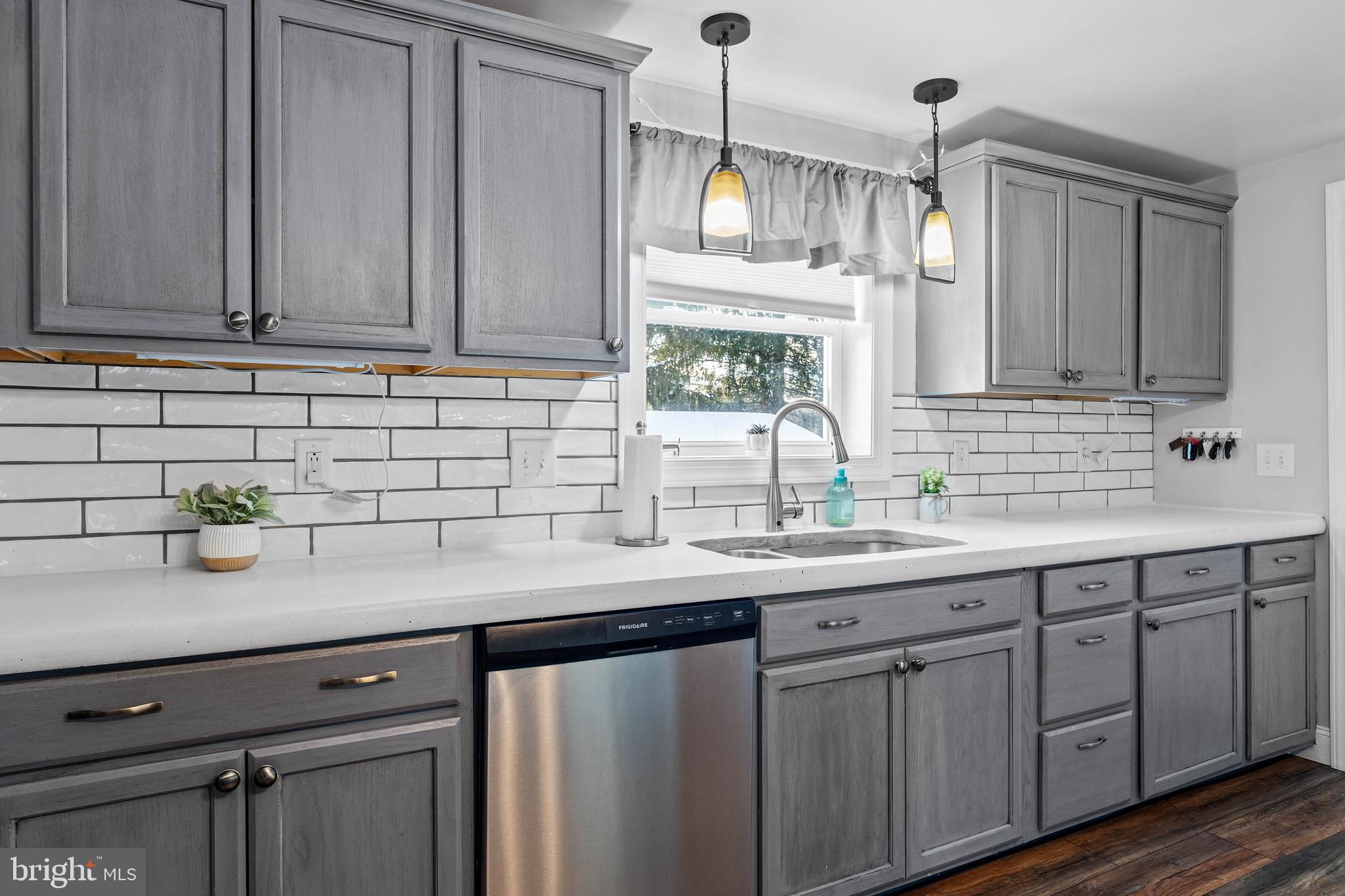 197 Ridge Street Smokerun, PA 16681 - Photo 7 of 47 a kitchen with stainless steel appliances granite countertop a sink a stove and cabinets