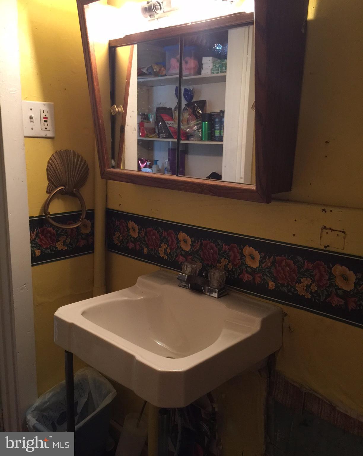 7506 Old Battle Grove Road Baltimore, MD 21222 - Photo 24 of 30 2nd bath has functional sink , plumbing reworked