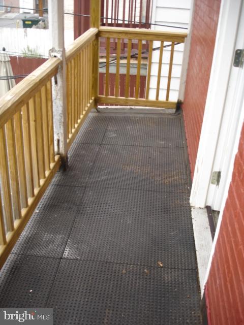 260 Verbeke Street Harrisburg, PA 17102 - Photo 12 of 20 Spacious balcony with inviting wooden railings.