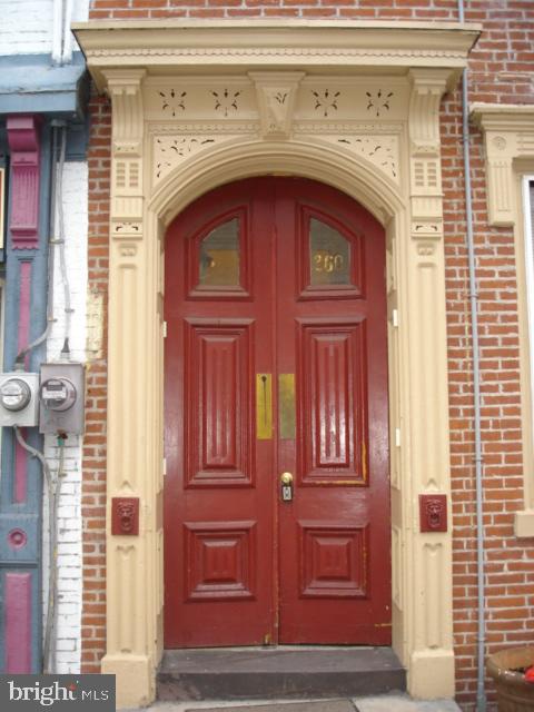 260 Verbeke Street Harrisburg, PA 17102 - Photo 2 of 20 Elegant red double doors with ornate trim.