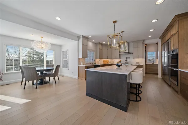 a kitchen with a sink and a refrigerator