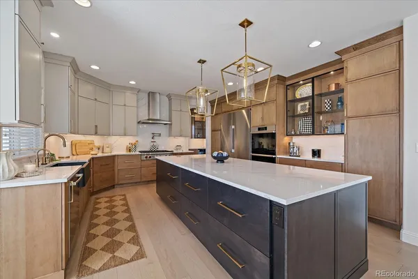 a kitchen with a sink appliances and cabinets