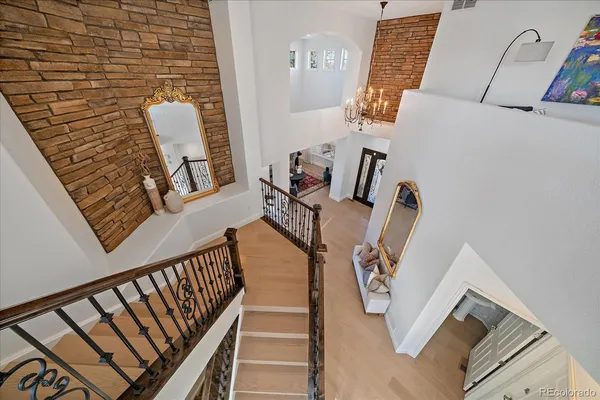 a view of living room with furniture and wooden floor