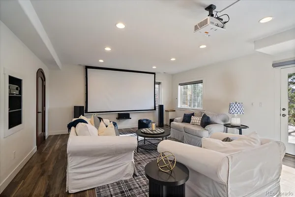 a bedroom with furniture and wooden floor