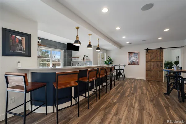a workspace with furniture and wooden floor