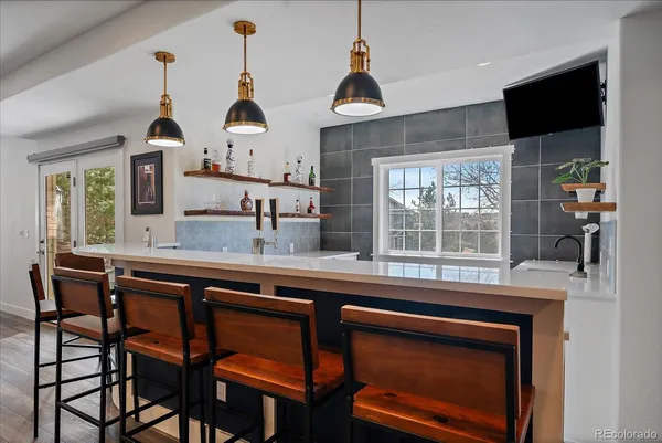 a kitchen with a sink cabinets and window