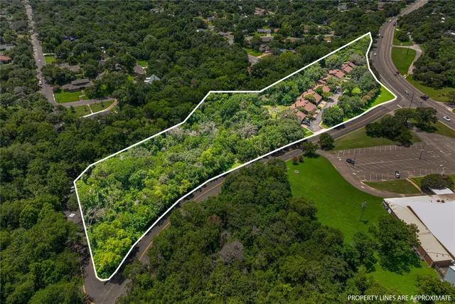 an aerial view of a swimming pool and outdoor space