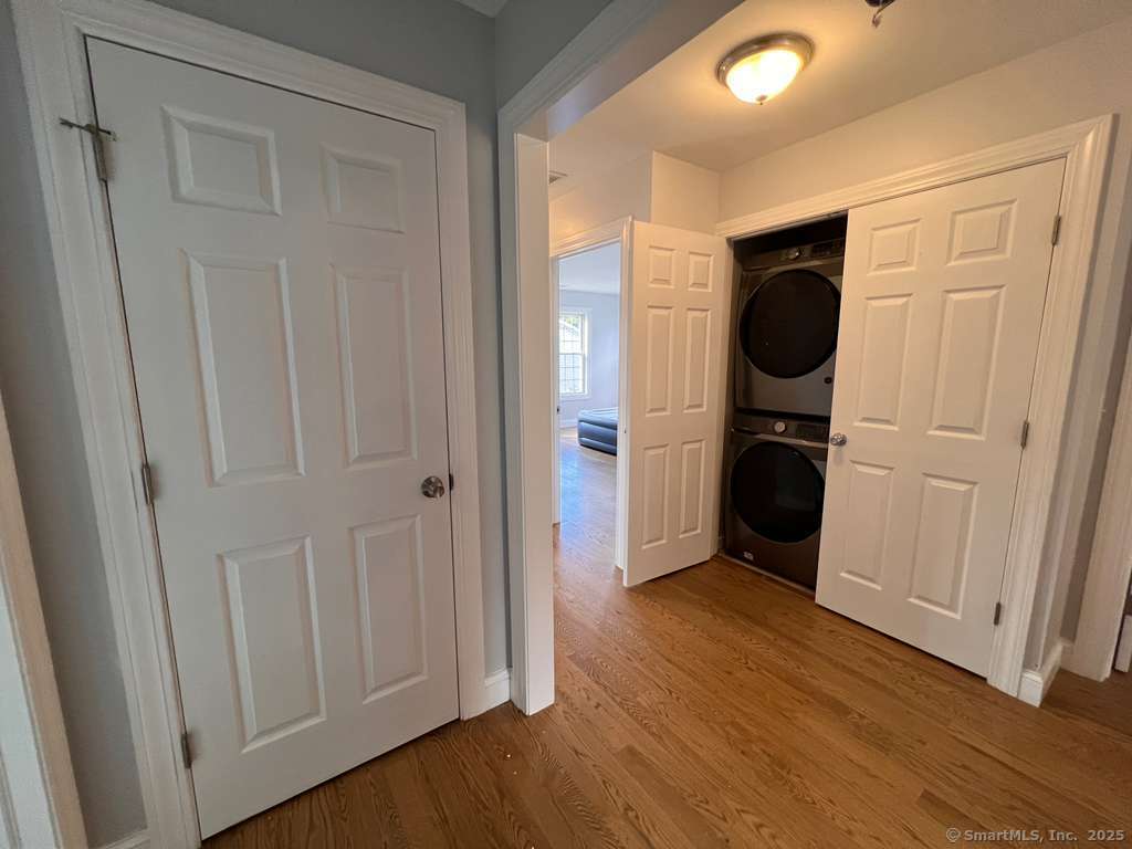 793 Pond Street Bridgeport, CT 06606 - Photo 15 of 28 a view of a hallway with wooden floor