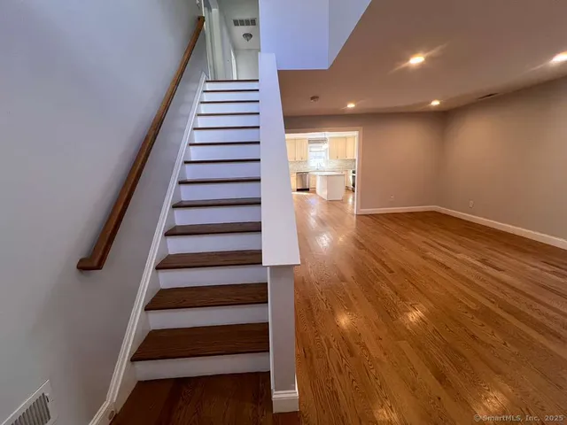 an entryway in a hall with a window