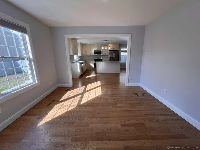 a view of a living room and dining room