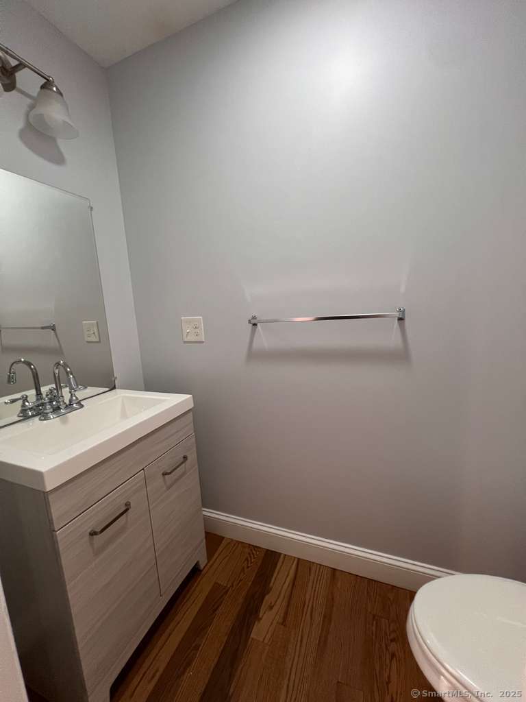 793 Pond Street Bridgeport, CT 06606 - Photo 8 of 28 a bathroom with a sink toilet and vanity