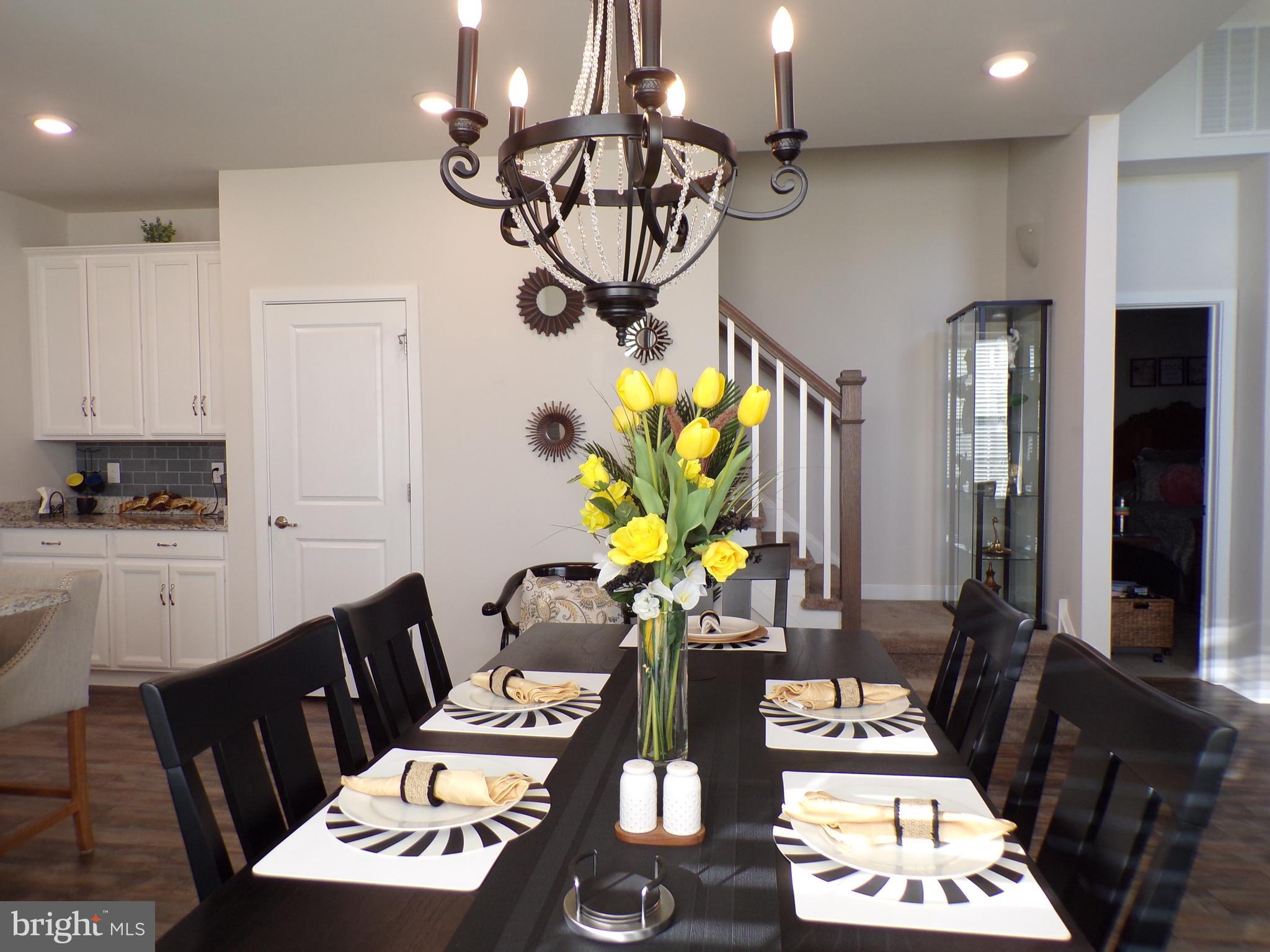 51 Bridge Boulevard Mount Holly, NJ 08060 - Photo 12 of 74 a view of a dining room with furniture one side kitchen view and a chandelier