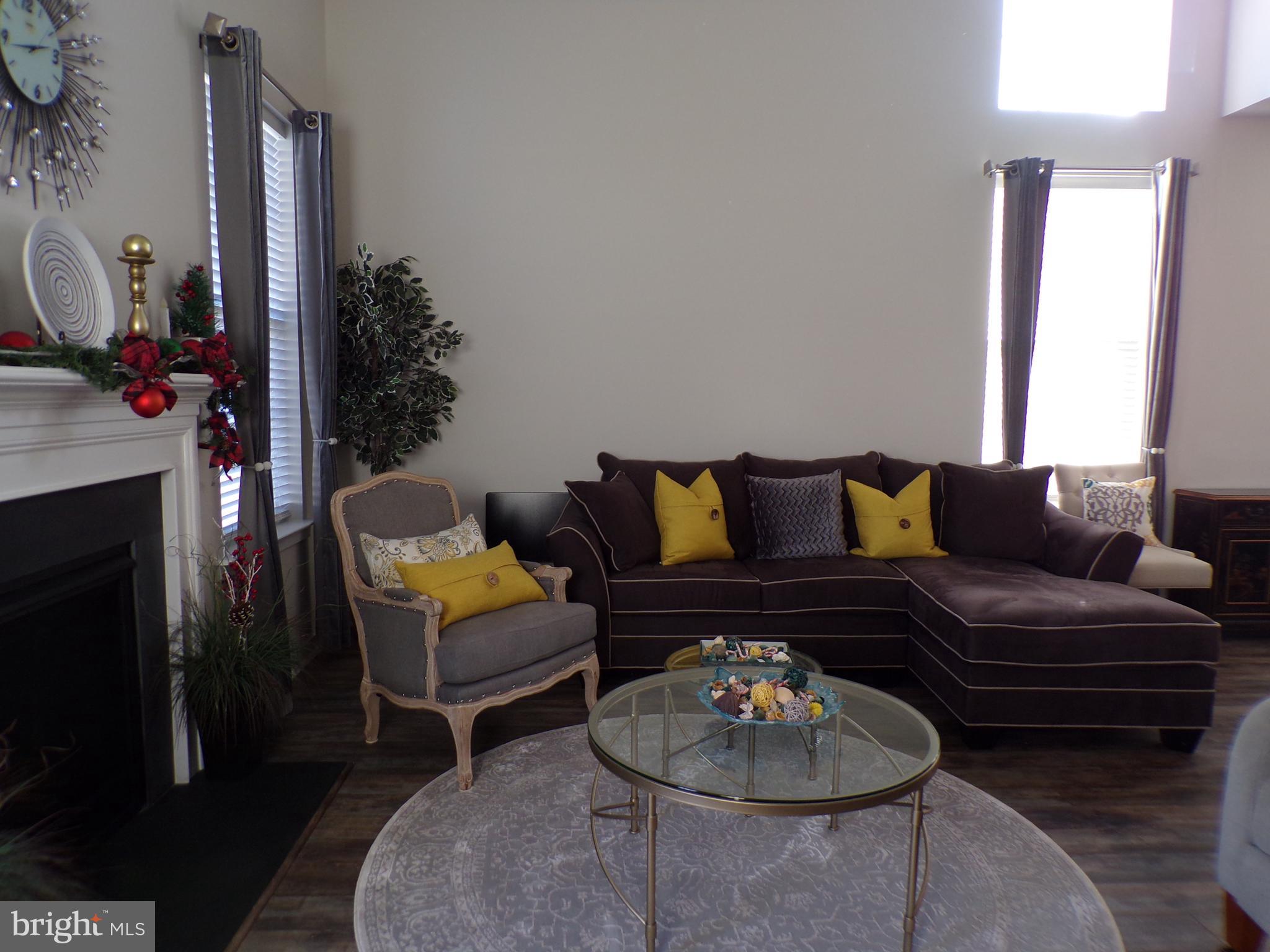 51 Bridge Boulevard Mount Holly, NJ 08060 - Photo 14 of 74 a living room with furniture and a potted plant