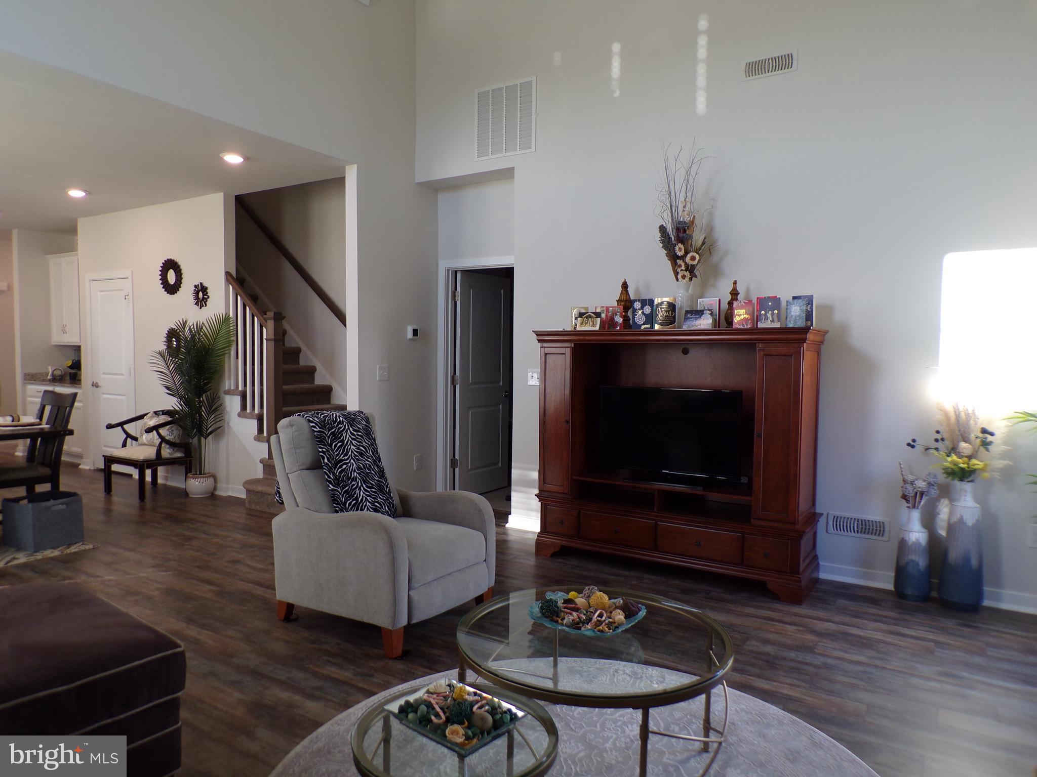 51 Bridge Boulevard Mount Holly, NJ 08060 - Photo 15 of 74 a living room with furniture a dining table and a fireplace