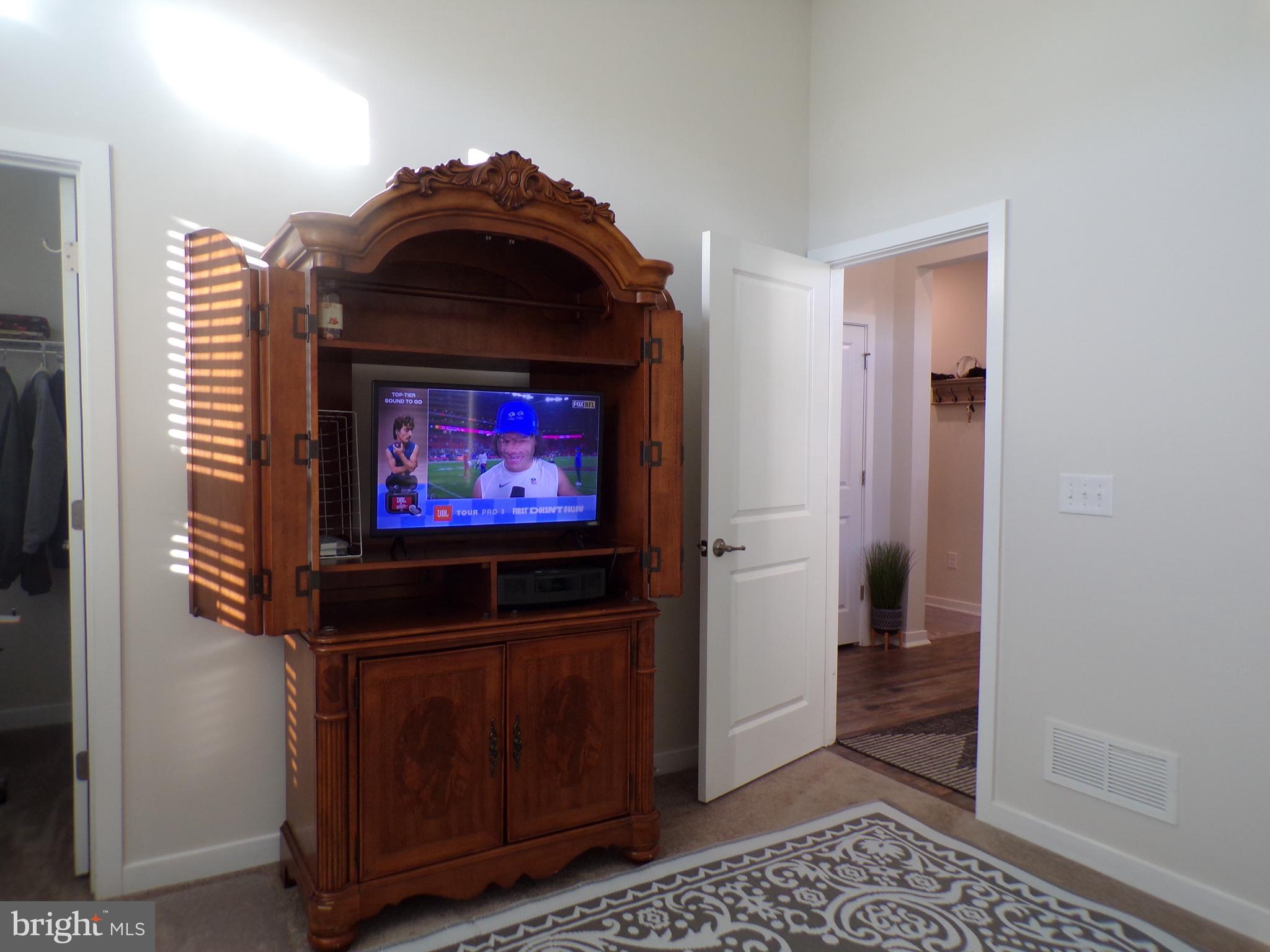 51 Bridge Boulevard Mount Holly, NJ 08060 - Photo 25 of 74 a living room with furniture and a flat screen tv