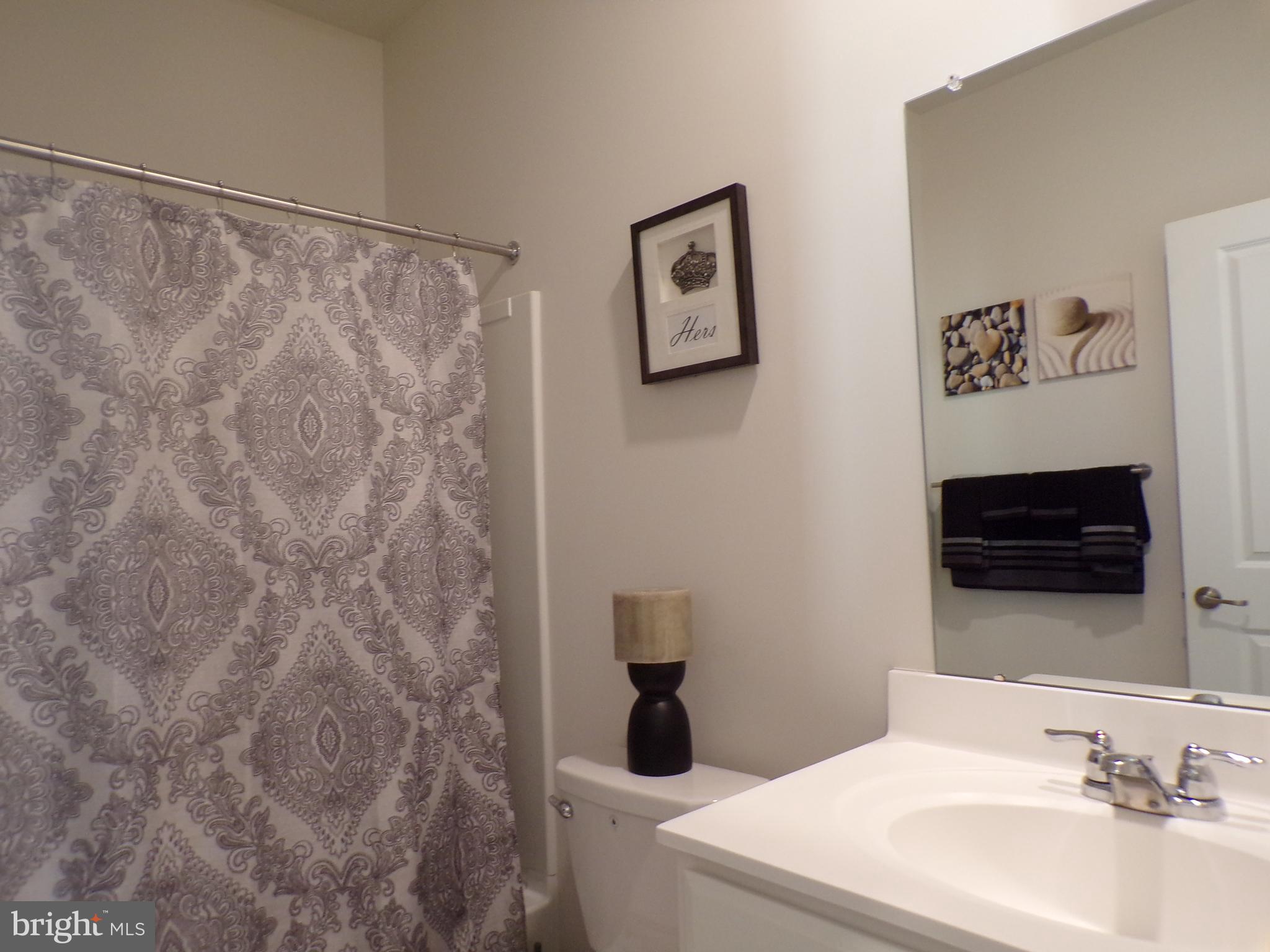 51 Bridge Boulevard Mount Holly, NJ 08060 - Photo 27 of 74 a bathroom with a sink and a mirror