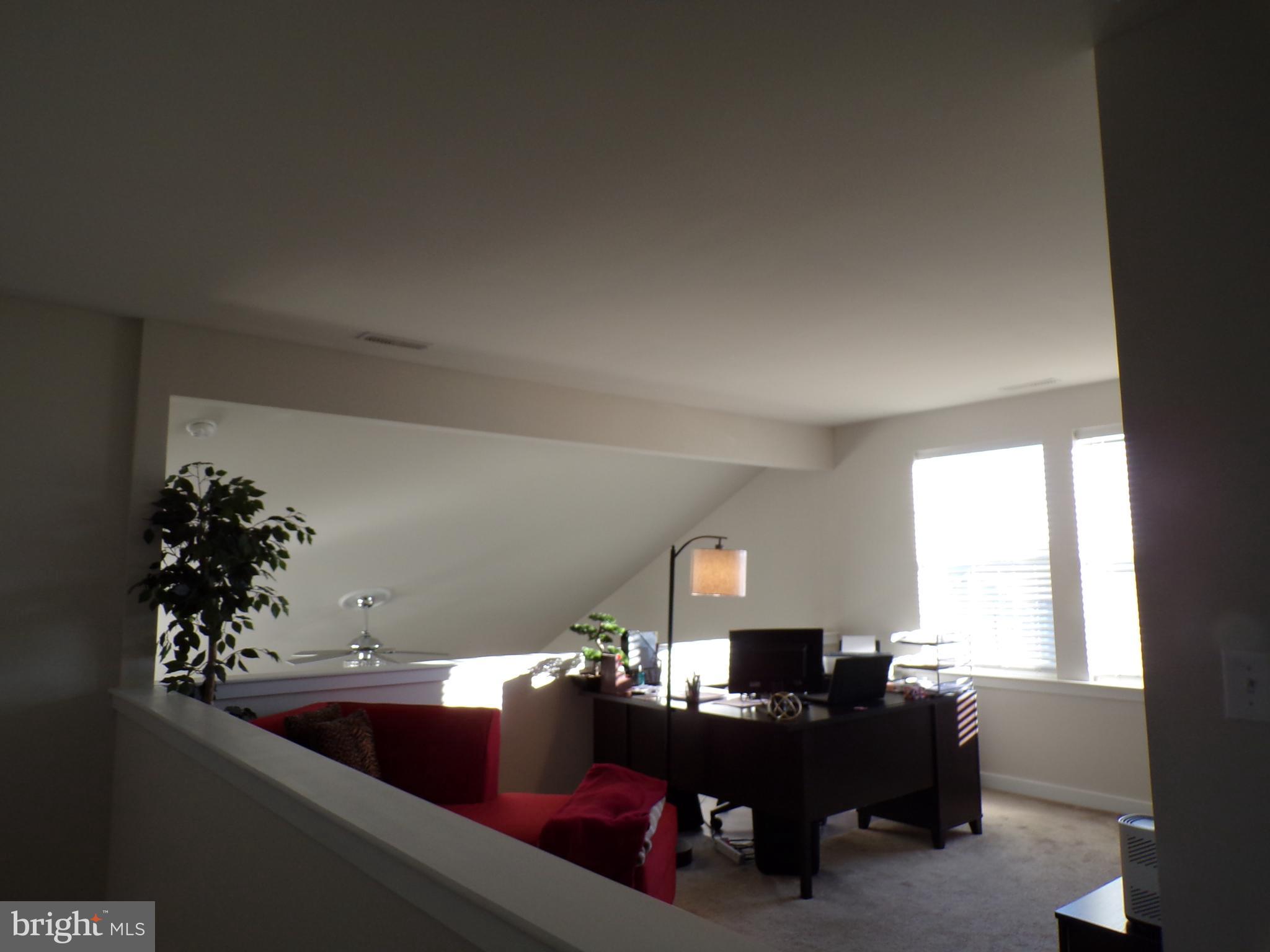 51 Bridge Boulevard Mount Holly, NJ 08060 - Photo 34 of 74 a living room with furniture and a window