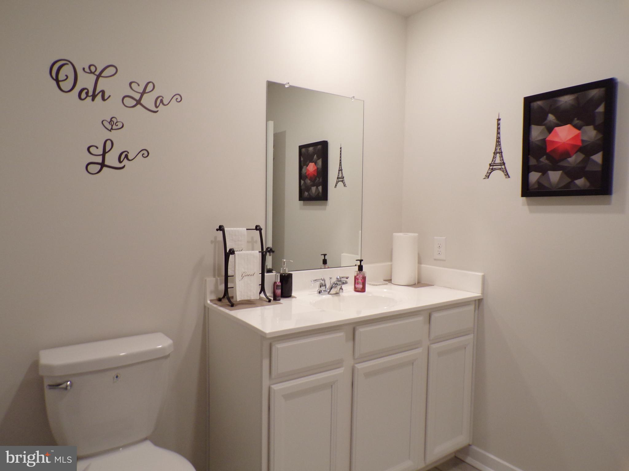 51 Bridge Boulevard Mount Holly, NJ 08060 - Photo 39 of 74 a bathroom with a toilet a sink and mirror