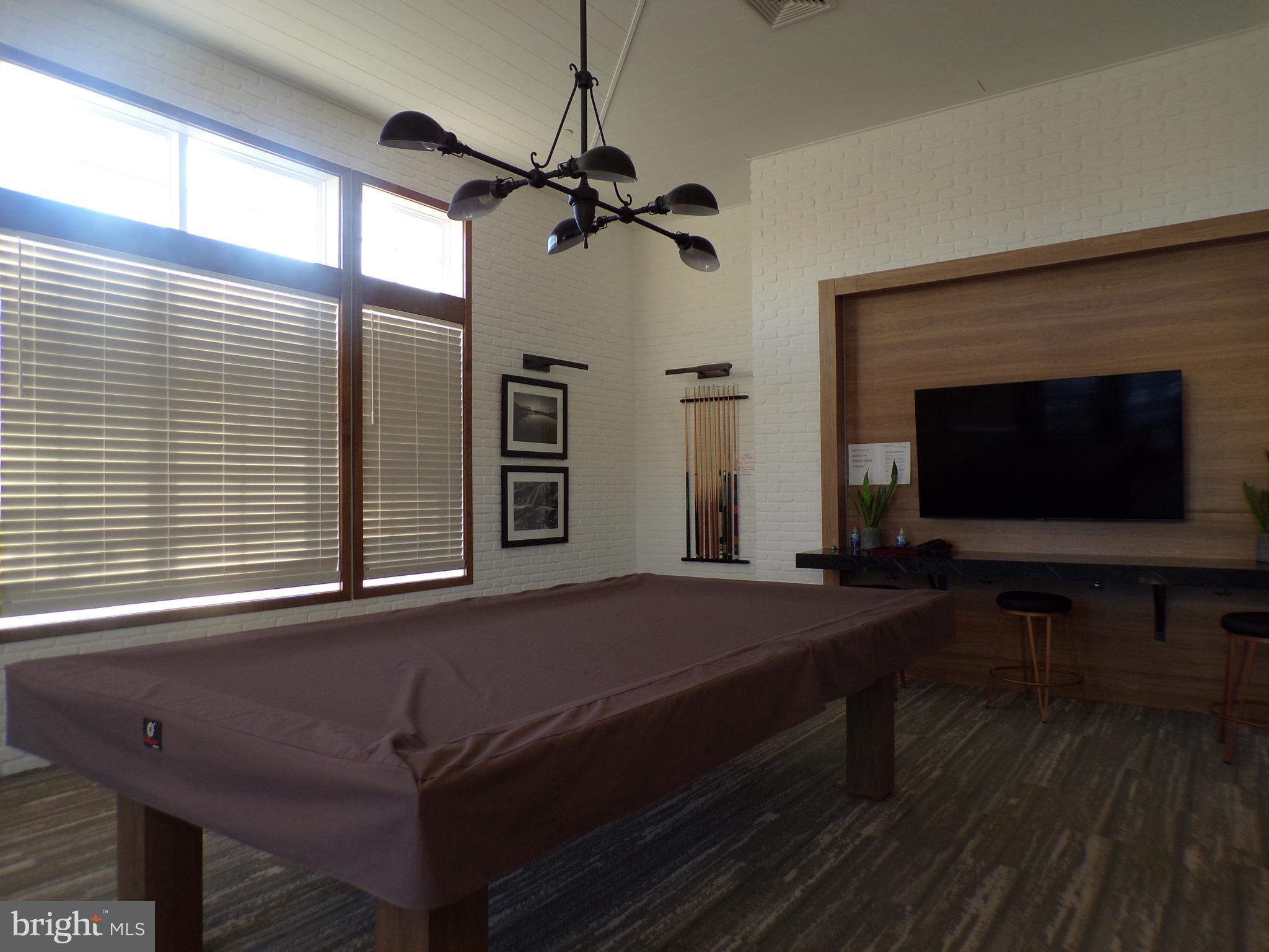 51 Bridge Boulevard Mount Holly, NJ 08060 - Photo 56 of 74 a living room with a bed furniture and a flat screen tv