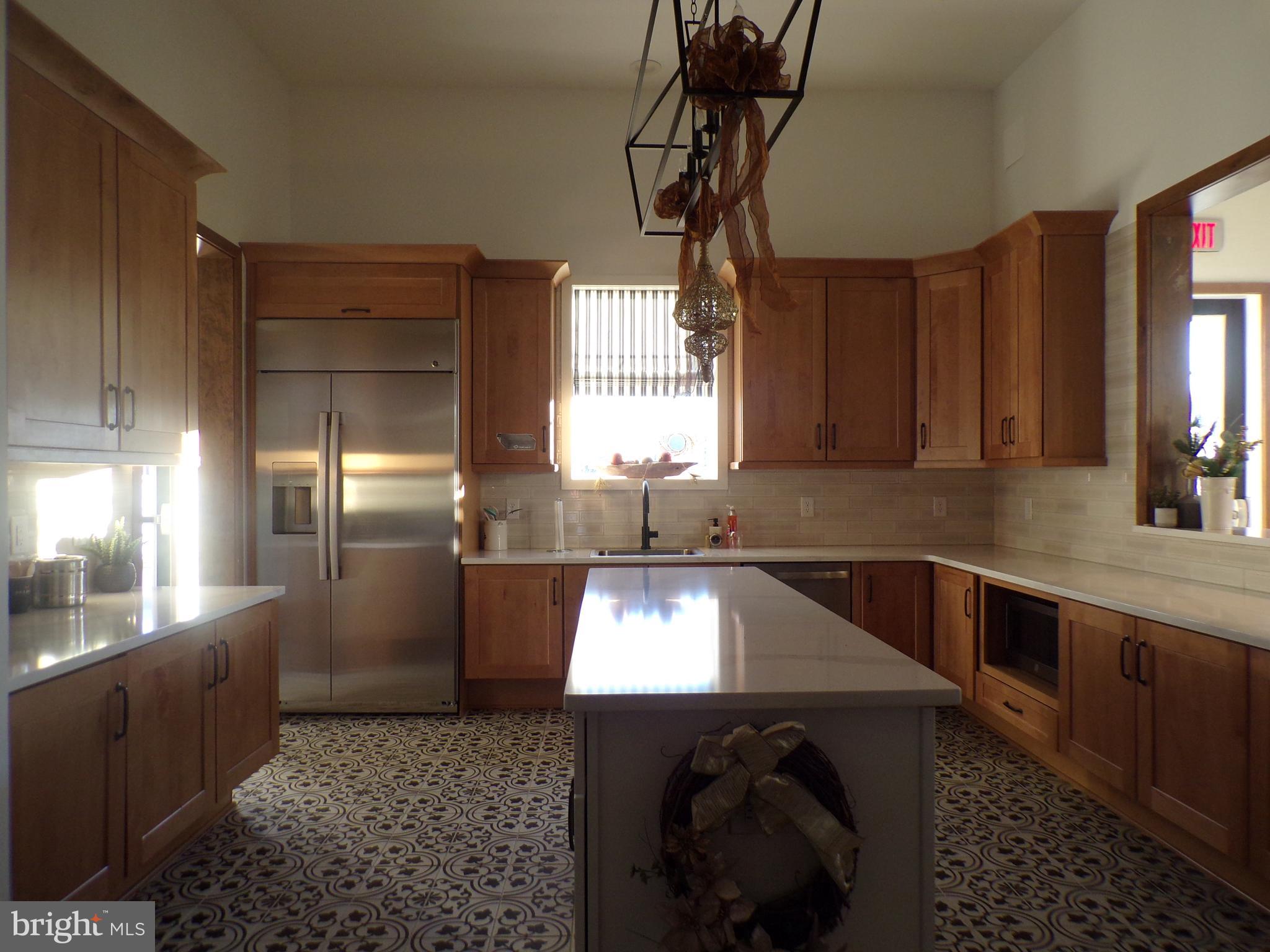 51 Bridge Boulevard Mount Holly, NJ 08060 - Photo 61 of 74 a kitchen with stainless steel appliances granite countertop a sink a stove and a refrigerator
