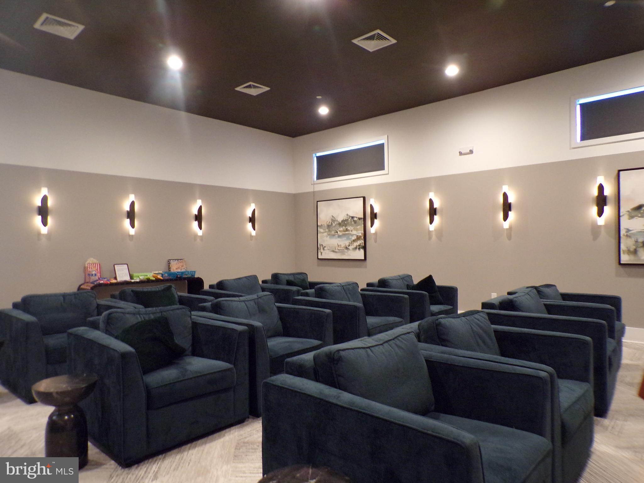 51 Bridge Boulevard Mount Holly, NJ 08060 - Photo 66 of 74 a media room with lots of chairs and a projector screen