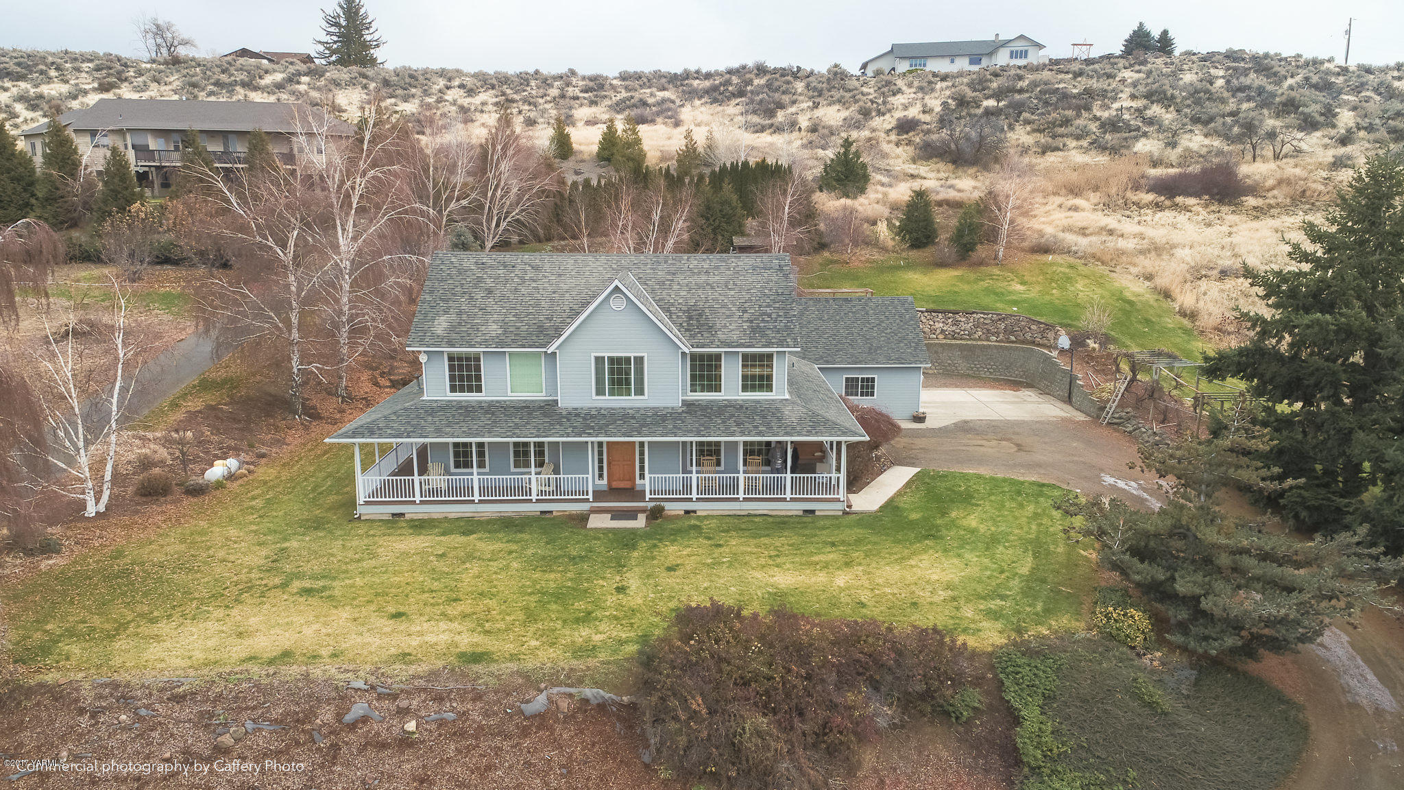 601 Hancock Road Cowiche, WA 98923 - Photo 24 of 28 a view of a house with a yard and sitting area