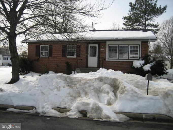 3918 Algiers Road Randallstown, MD 21133 - Photo 1 of 17 a front view of a house with a yard