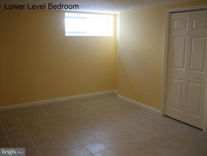 3918 Algiers Road Randallstown, MD 21133 - Photo 15 of 17 an empty room with a window