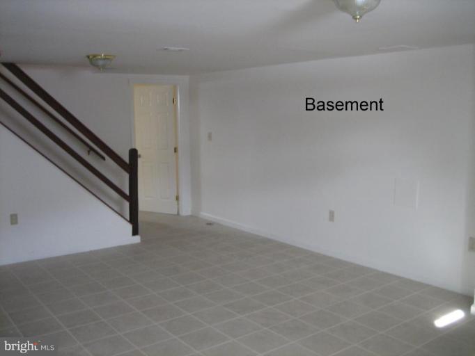 3918 Algiers Road Randallstown, MD 21133 - Photo 17 of 17 a view of a hallway with staircase