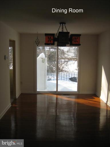 3918 Algiers Road Randallstown, MD 21133 - Photo 3 of 17 a view of empty room with wooden floor and fan