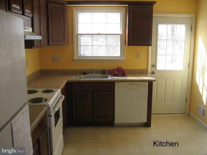 3918 Algiers Road Randallstown, MD 21133 - Photo 4 of 17 a utility room with a sink a washer and dryer