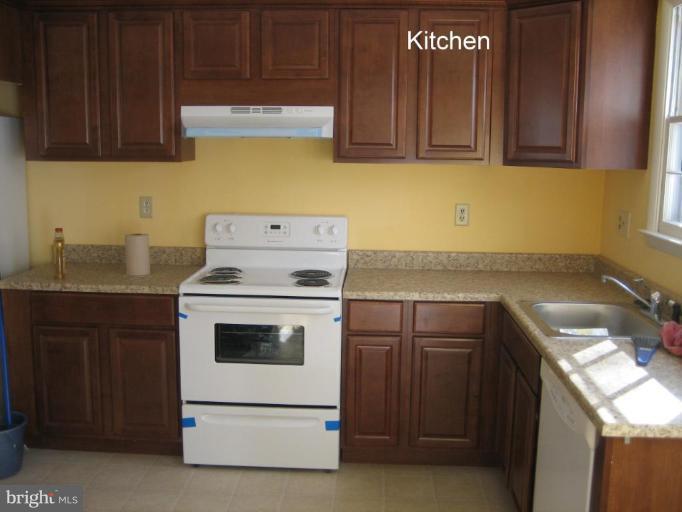 3918 Algiers Road Randallstown, MD 21133 - Photo 5 of 17 a kitchen with a stove and a sink