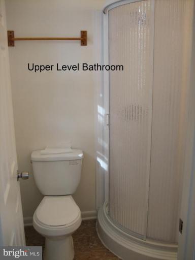 3918 Algiers Road Randallstown, MD 21133 - Photo 8 of 17 a bathroom with a toilet and a mirror