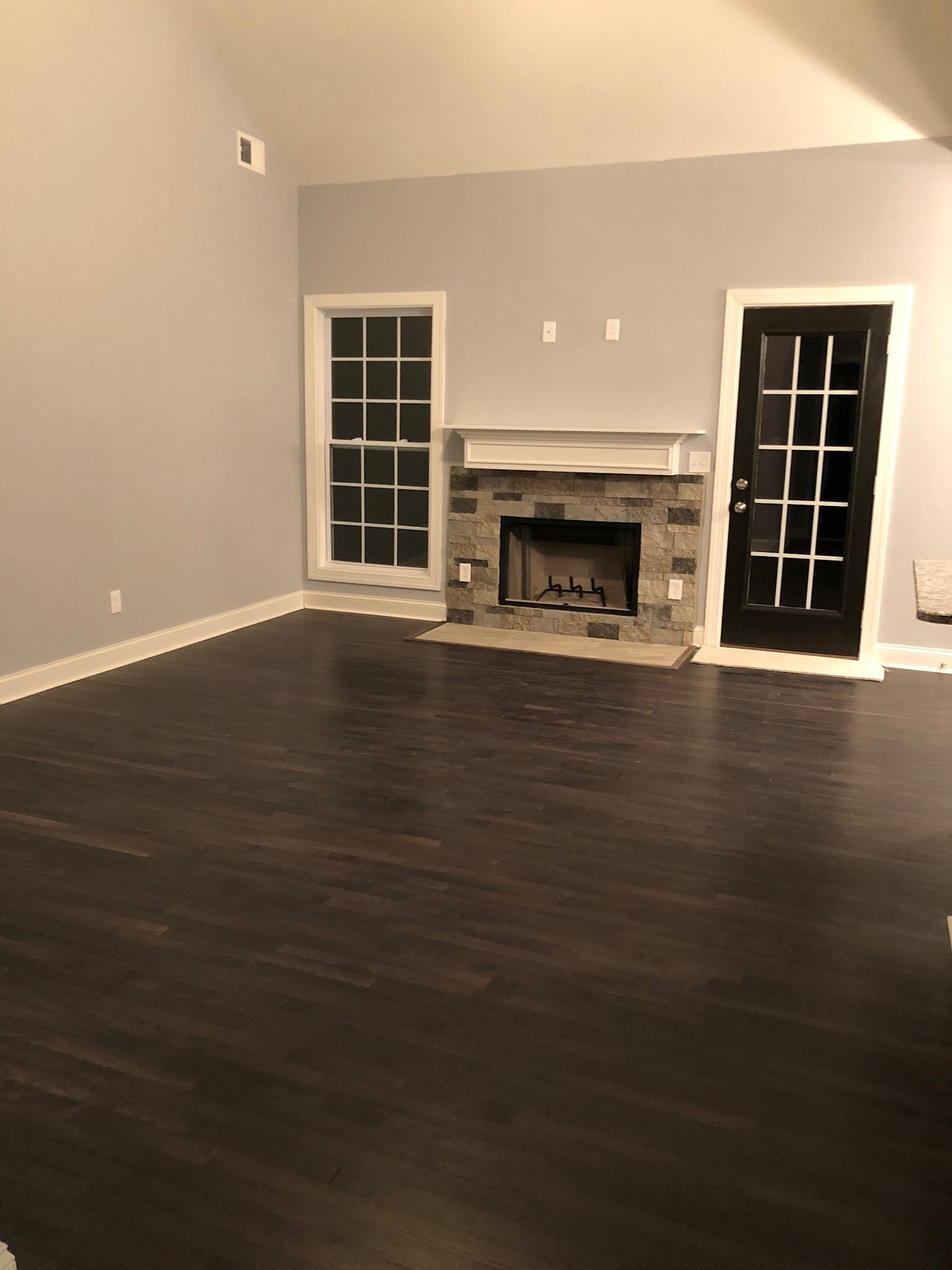 405 Tom Link Road Cottontown, TN 37048 - Photo 7 of 25 Great room Stone wood burning fireplace