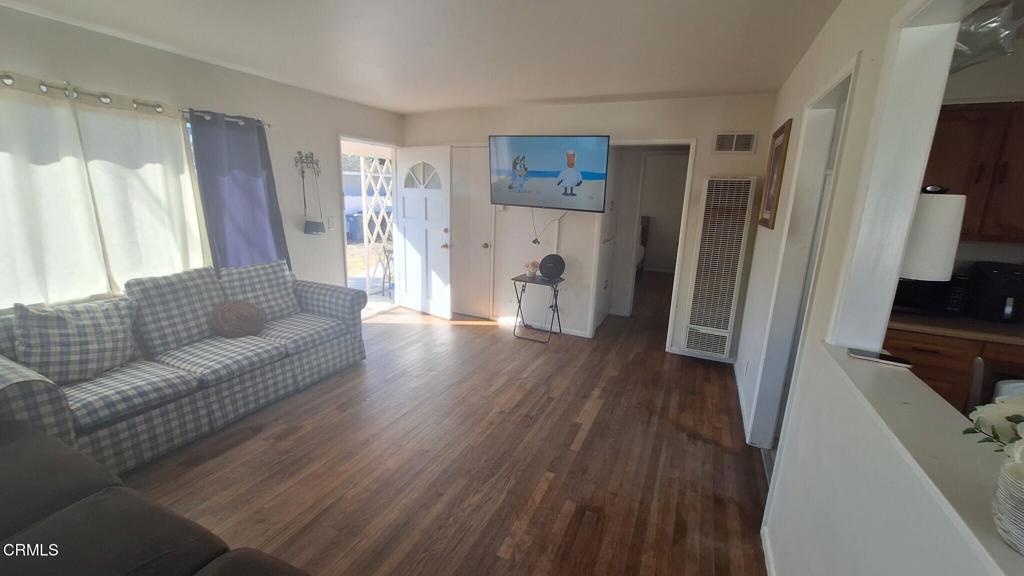 60 Princeton Avenue Oxnard, CA 93036 - Photo 3 of 10 a living room with furniture and a wooden floor
