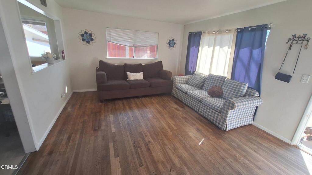 60 Princeton Avenue Oxnard, CA 93036 - Photo 4 of 10 a living room with furniture and a wooden floor