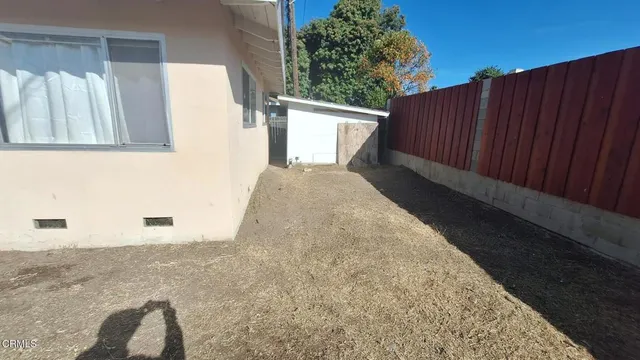 a view of backyard with tub