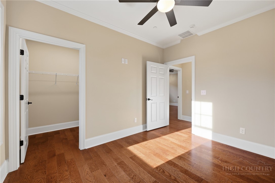 155 Gateway Drive, Unit 102 Boone, NC 28607 - Photo 16 of 43 a view of empty room with wooden floor