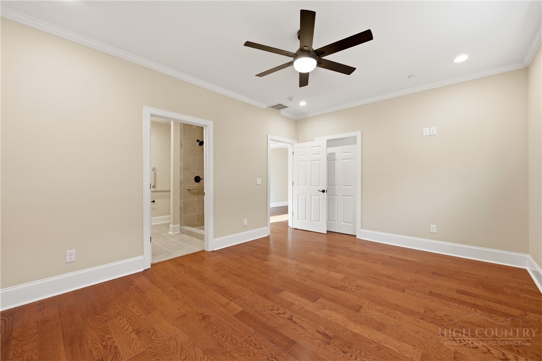 155 Gateway Drive, Unit 102 Boone, NC 28607 - Photo 20 of 43 an empty room with fan and a ceiling fan