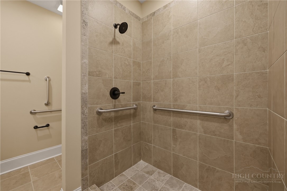 155 Gateway Drive, Unit 102 Boone, NC 28607 - Photo 22 of 43 a bathroom with a shower
