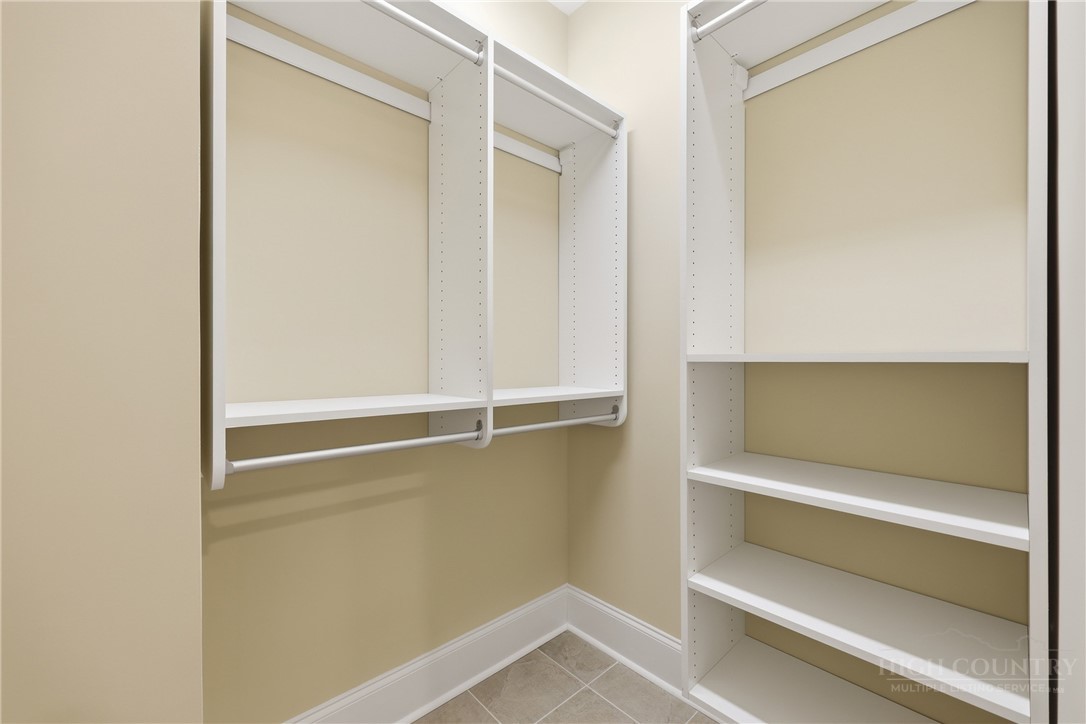155 Gateway Drive, Unit 102 Boone, NC 28607 - Photo 25 of 43 a view of walk in closet with empty racks