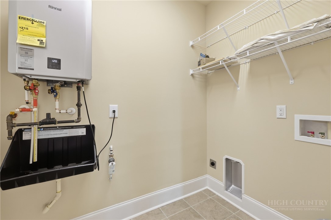 155 Gateway Drive, Unit 102 Boone, NC 28607 - Photo 27 of 43 a view of storage and utility room with racks on the wall