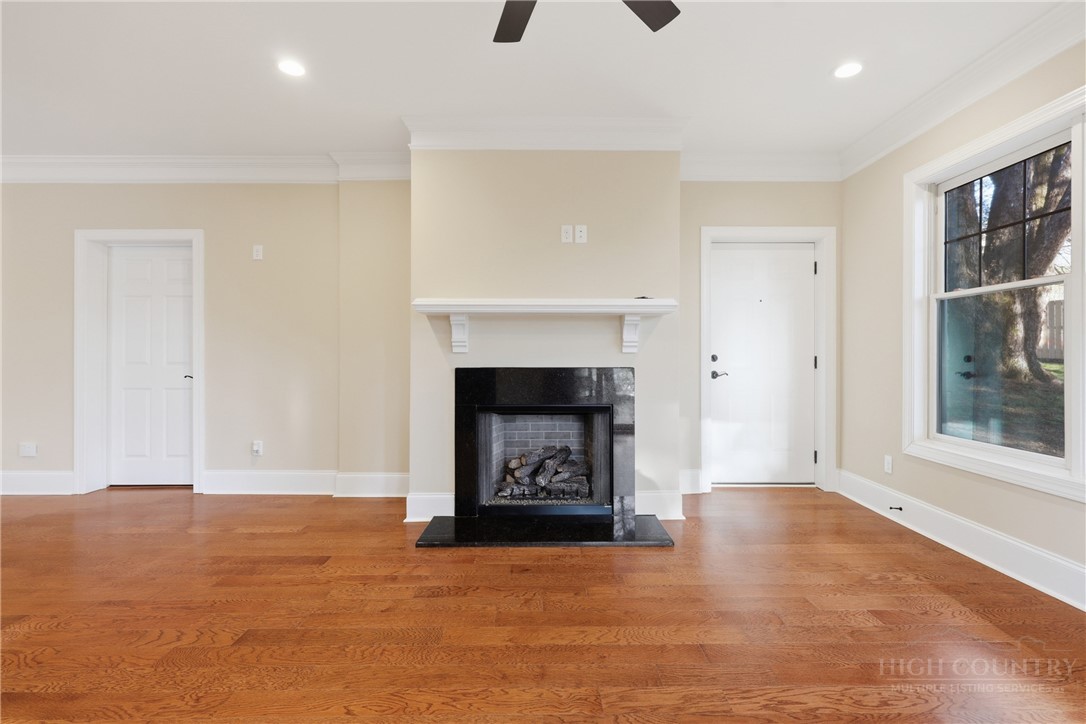155 Gateway Drive, Unit 102 Boone, NC 28607 - Photo 6 of 43 a view of an empty room with window and fire place