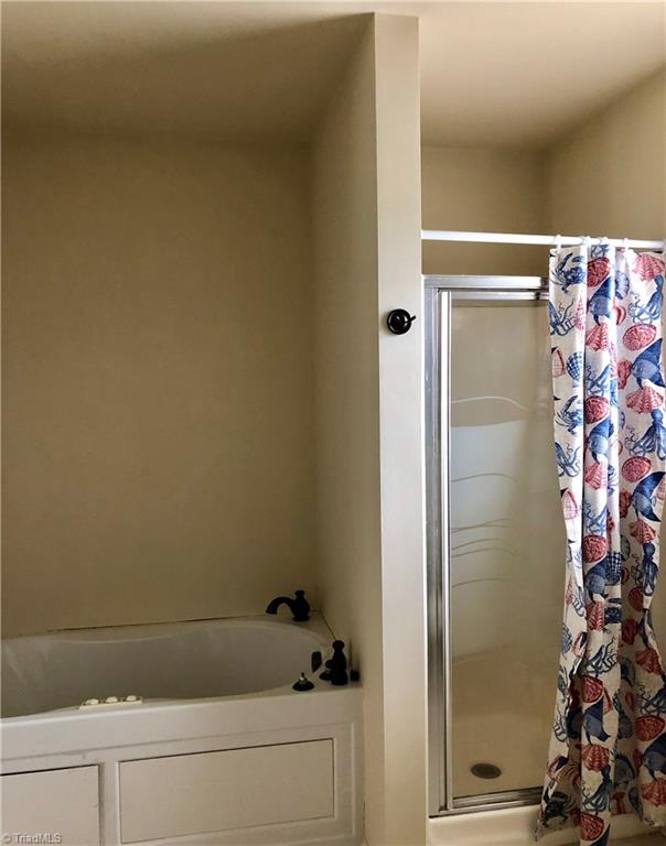 589 Whitney Road Mocksville, NC 27028 - Photo 14 of 25 Jacuzzi tub in master bath. Tub has a cover