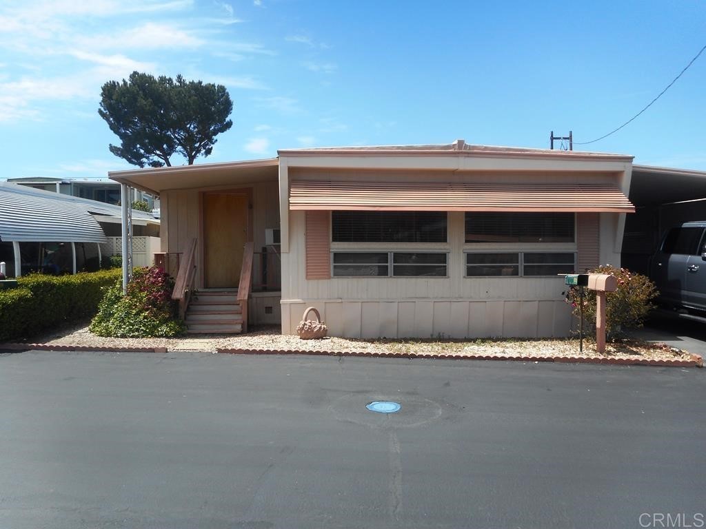 28890 Lilac Road, Unit 172 Valley Center, CA 92082 - Photo 1 of 1 a front view of a house with porch
