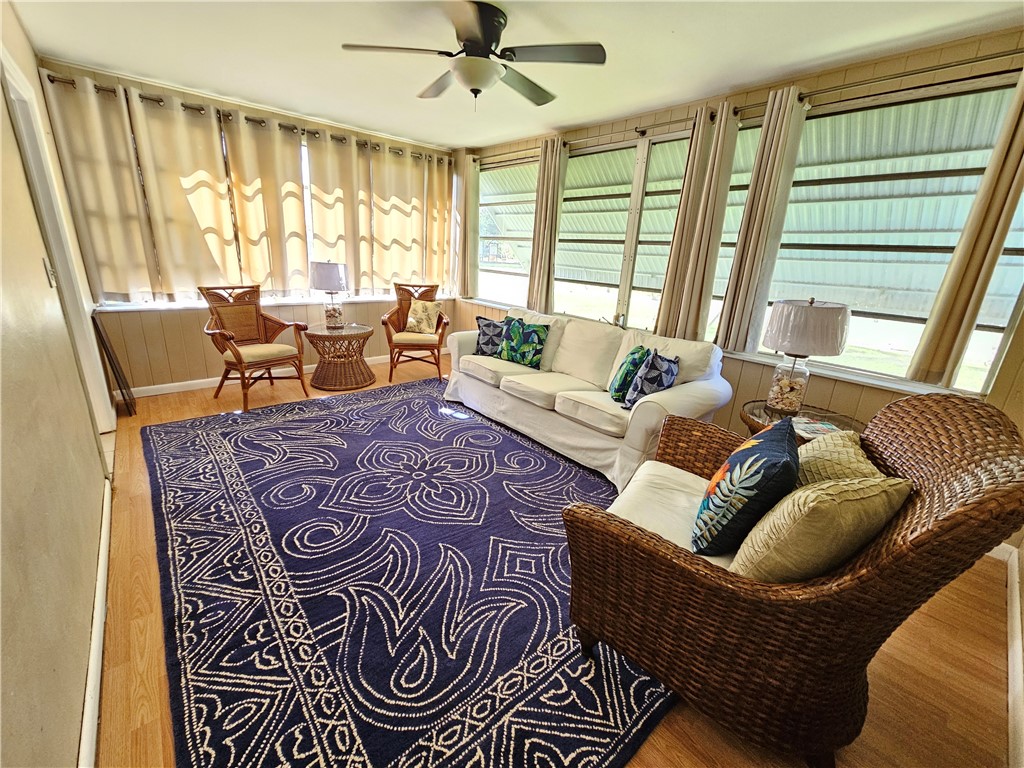 3716 Atlantic Boulevard Vero Beach, FL 32960 - Photo 4 of 22 a living room with furniture and a large window