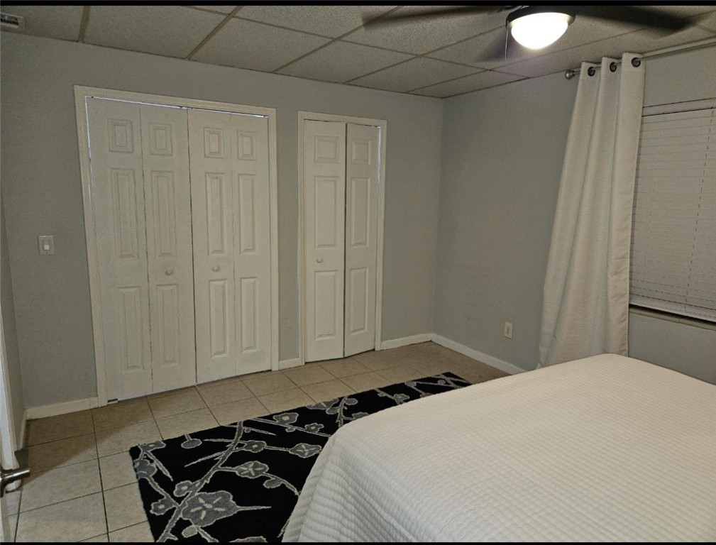 3716 Atlantic Boulevard Vero Beach, FL 32960 - Photo 10 of 22 a bedroom with a bed and a window