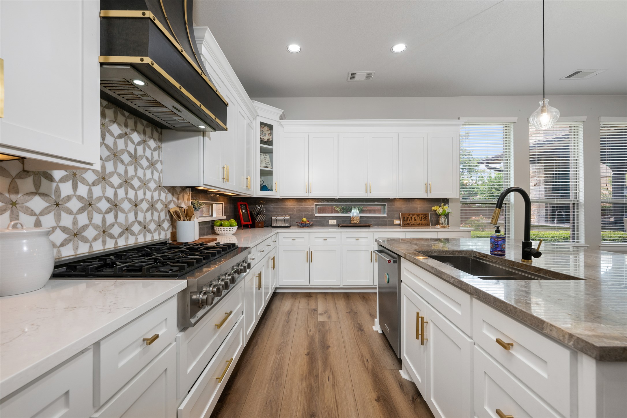 3021 Wedgescale Pass Leander, TX 78641 - Photo 11 of 40 a kitchen with stainless steel appliances granite countertop a sink stove and cabinets
